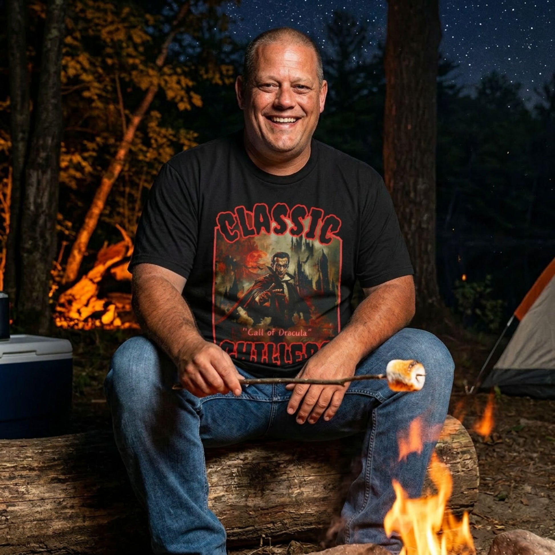 "The Call of Dracula" black t-shirt with vampire and castle graphic and classic chillers logo; front view; on model roasting a marshmallow over a campfire at night.

