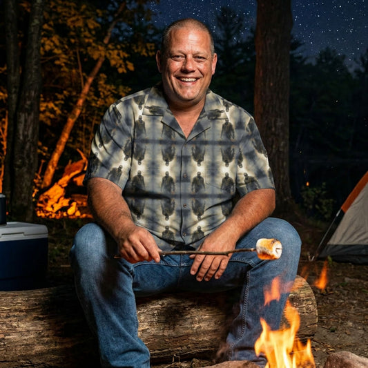 "Frankenstein" men’s Hawaiian shirt with gothic horror creature graphic in monster aloha pattern; on model roasting a marshmallow over a campfire at night.
