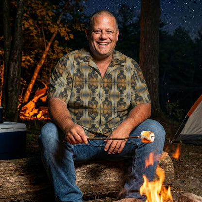 "Sinister Mr Hyde" men’s Hawaiian shirt with gothic man of murder graphic in monster aloha pattern; on model roasting a marshmallow over a campfire at night.
