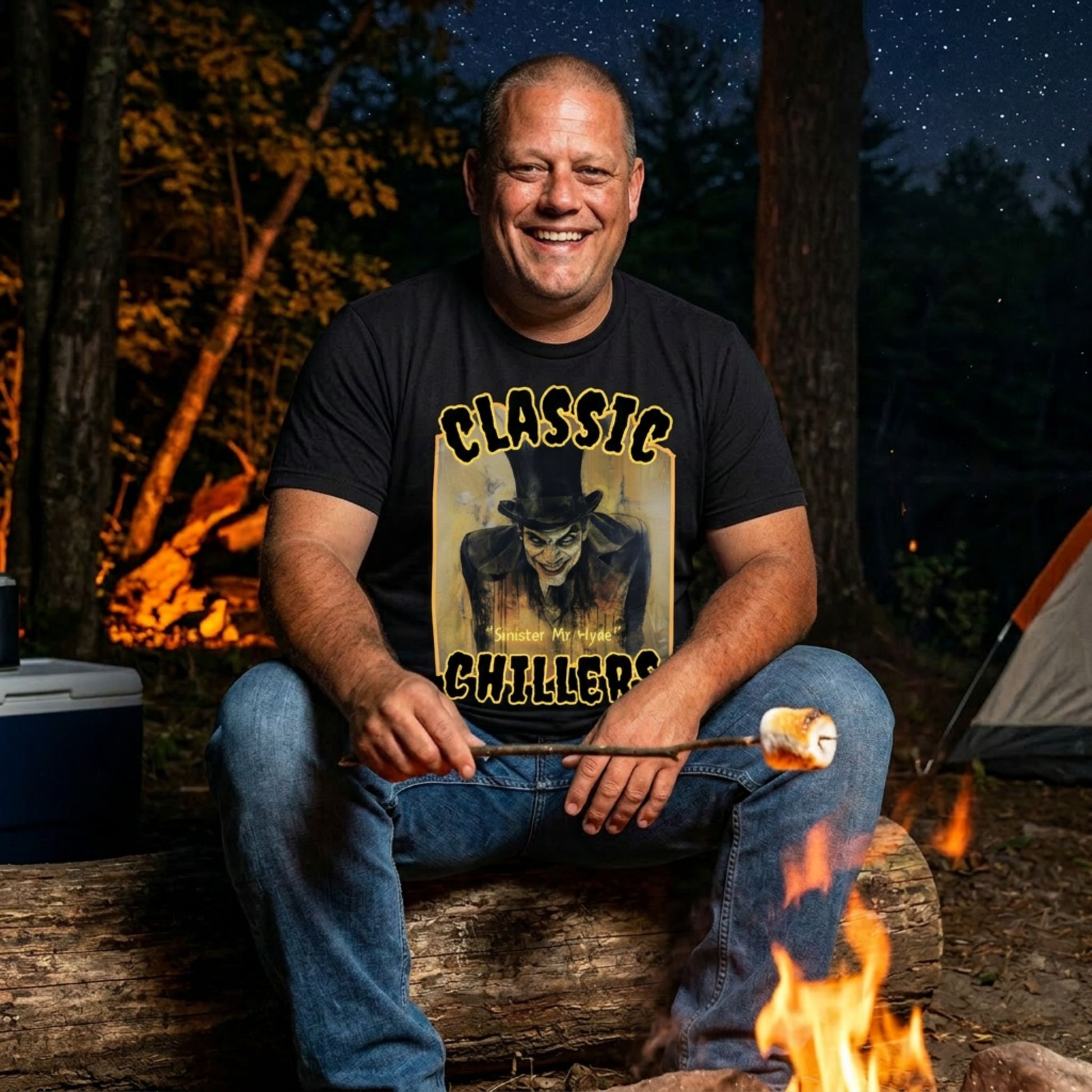 "Sinister Mr Hyde" black t-shirt with gothic man of murder graphic and classic chillers logo; front view; on model roasting a marshmallow over a campfire at night.
