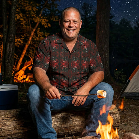 "Vampire Thriller" men’s Hawaiian shirt with creepy night stalker graphic in monster aloha pattern; on model roasting a marshmallow over a campfire at night.

